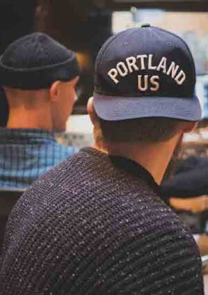 Happy stylish hipster man using technology